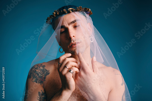 Man in transparent veil in studio photo
