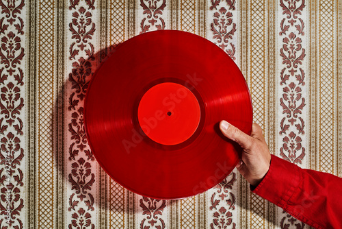 man has a red disc in his hand