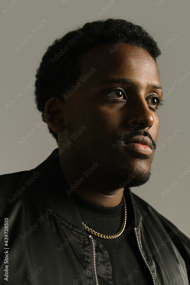 Serious black man in stylish wear in studio Serious black man in stylish wear in studio