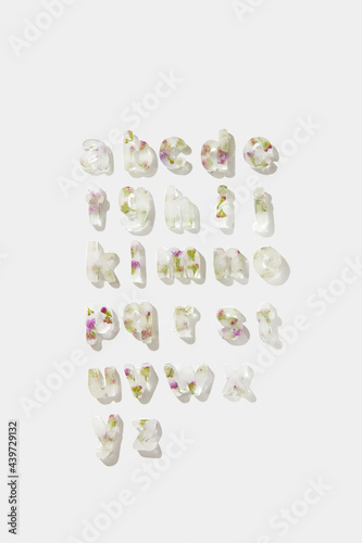 Alphabet letters with small purple flowers photo
