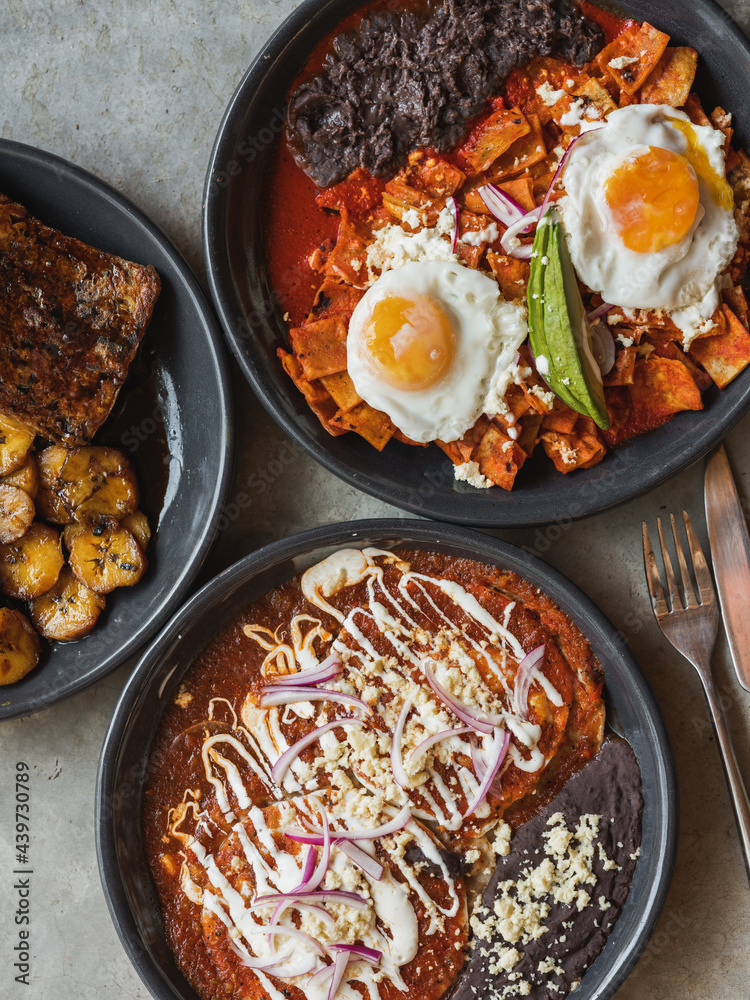 A Mexican breakfast, three dishes seen on a concrete background. Stock