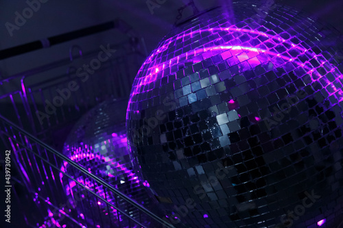 Shiny disco balls in neon lights