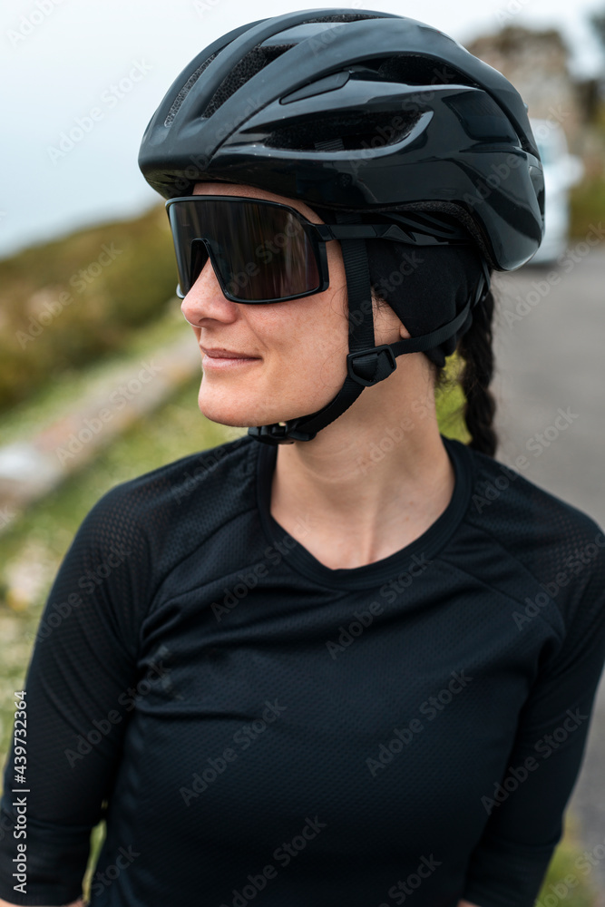 Attractive woman resting on electric bike near van 