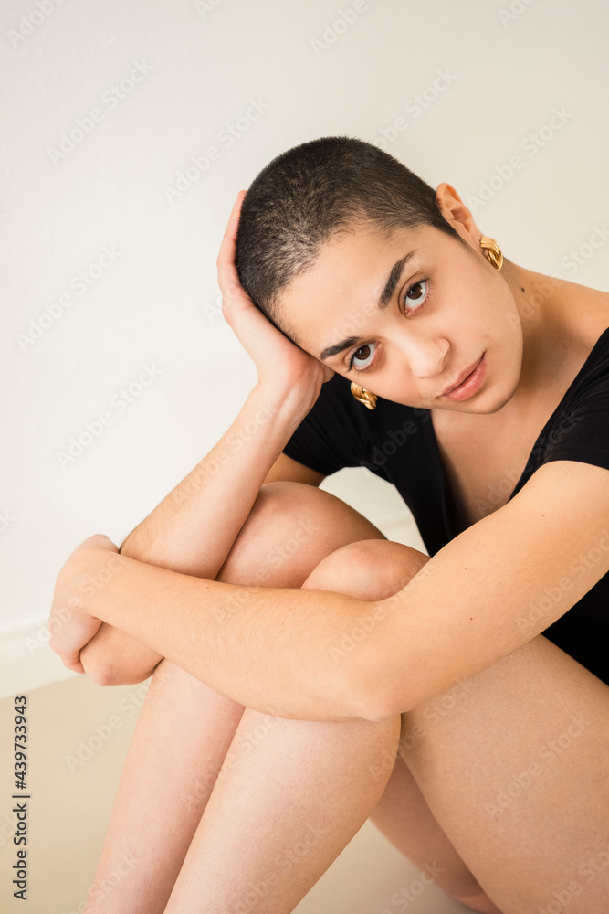 Portrait Of A Shaved Woman in Yoga Outfit Looking At The Camera 