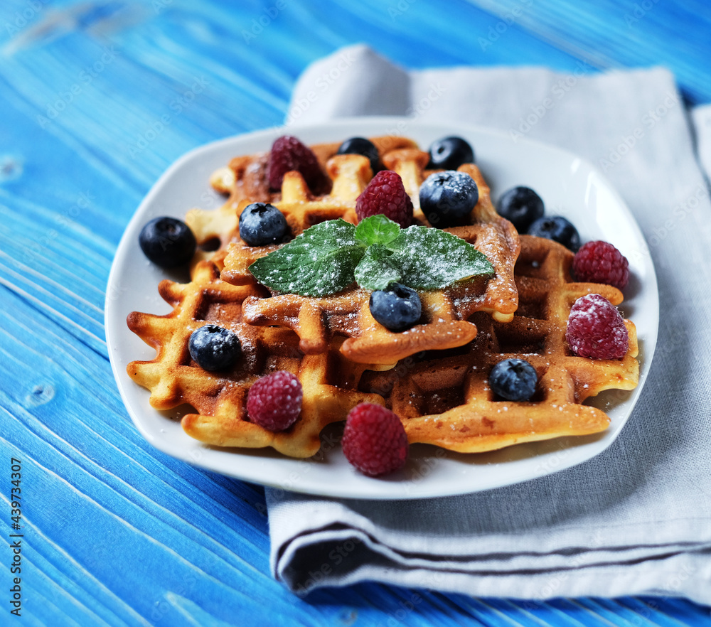 Homemade Belgian waffles served with fresh berries Homemade Belgian waffles served with fresh berries