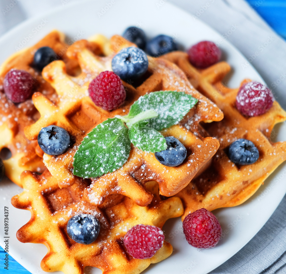 Homemade Belgian waffles served with fresh berries Homemade Belgian waffles served with fresh berries