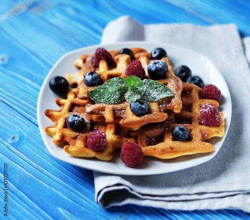 Homemade Belgian waffles served with fresh berries