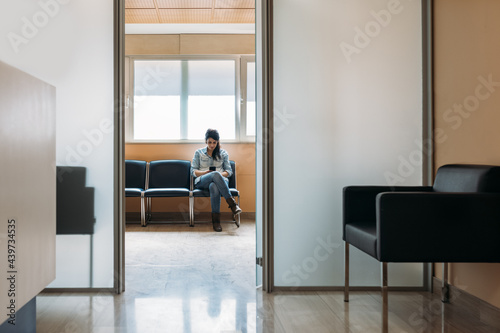 Woman in a waiting room inside the hospital photo