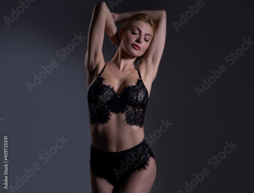 Beautiful sensual woman fashion model. Sexy female posing in studio. © Volodymyr