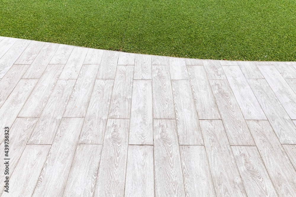 Fototapeta premium White wooden floors and green artificial turf outside the building pattern and background seamless
