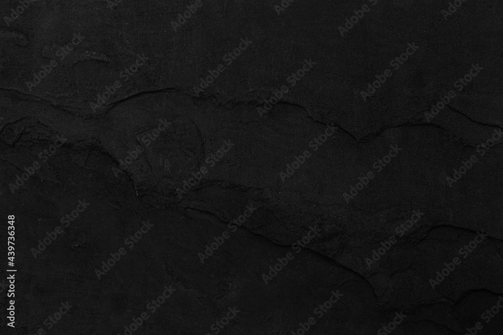 Naklejka premium Dark grey black slate background or texture. Black granite slabs background