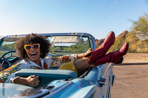 Happy Friends Talking in Vintage car on road trip 