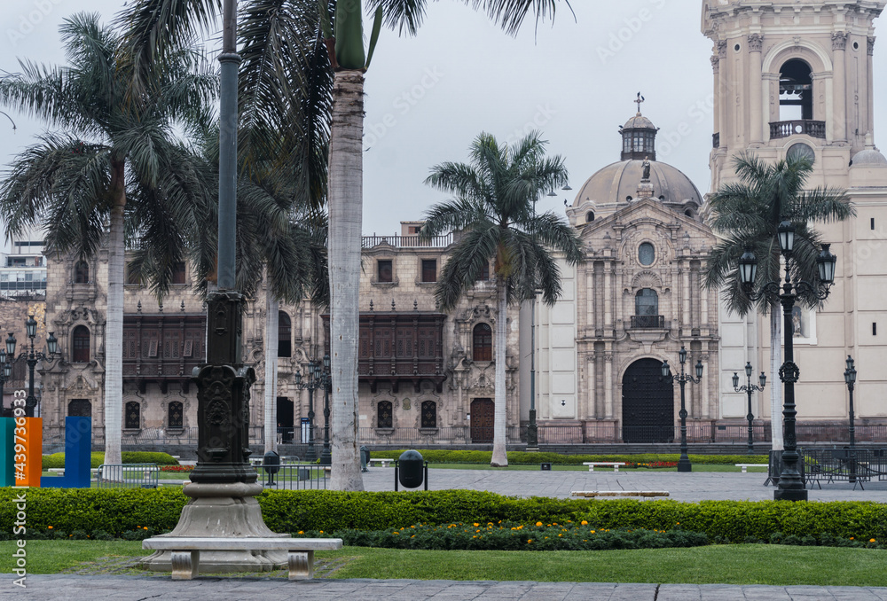 Lima main square empty during pandemic times, view of Lima cathedral , Archbishop’s Palace, palms in main square