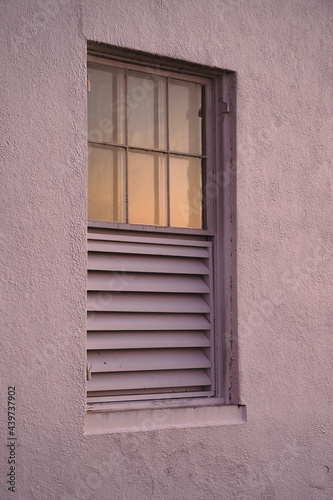 Window reflecting the sunset photo