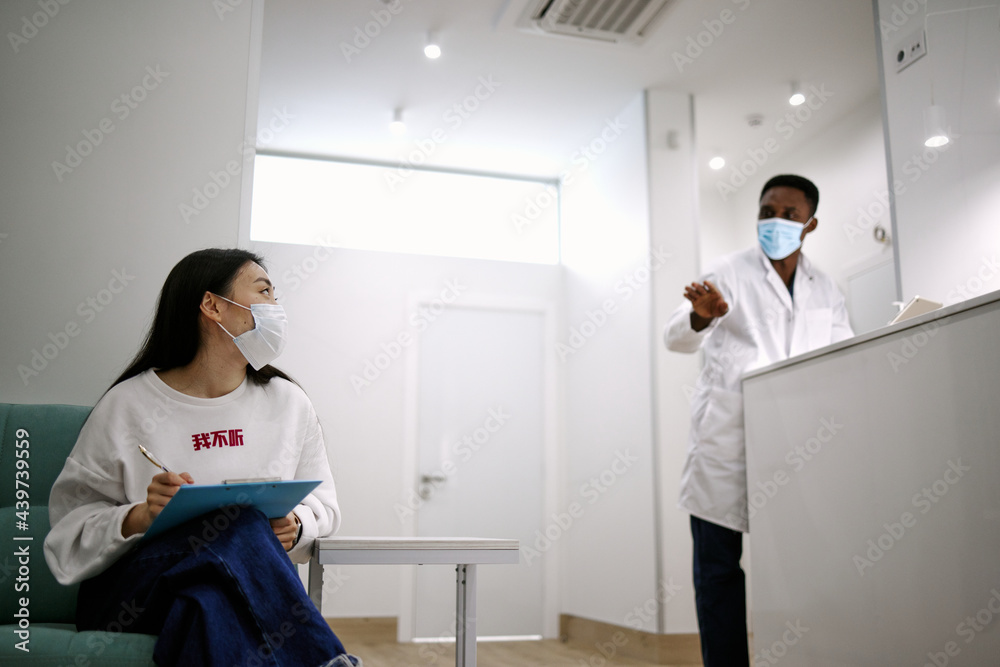 Doctor explaining woman conditions of medical prevention during covid-19 Doctor explaining woman conditions of medical prevention during covid-19