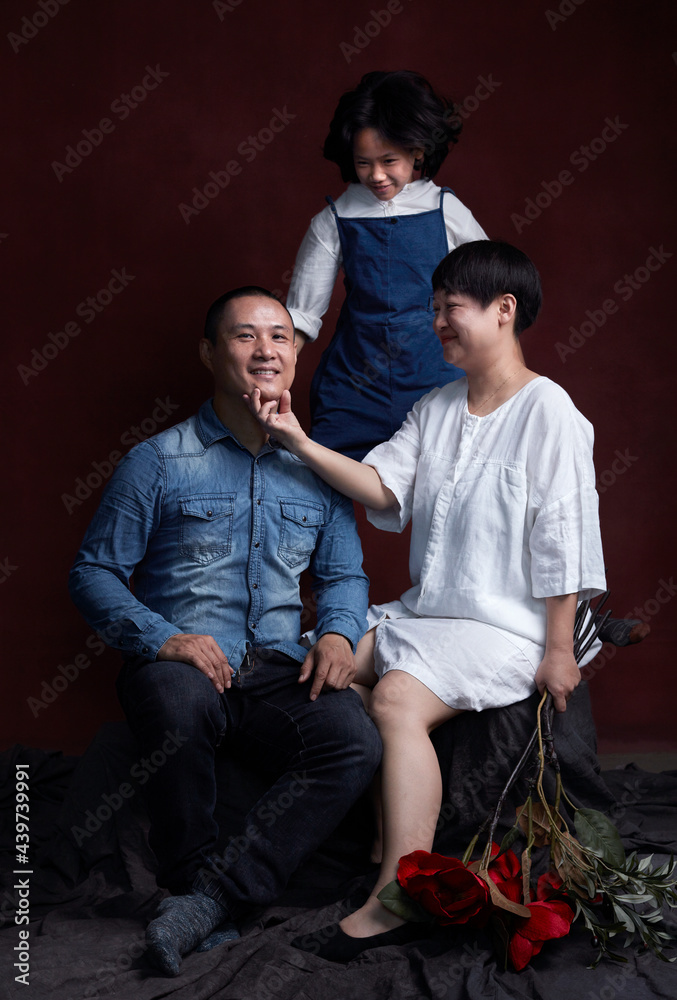 Portrait of an Asian family of three, indoors. Portrait of an Asian family of three, indoors.