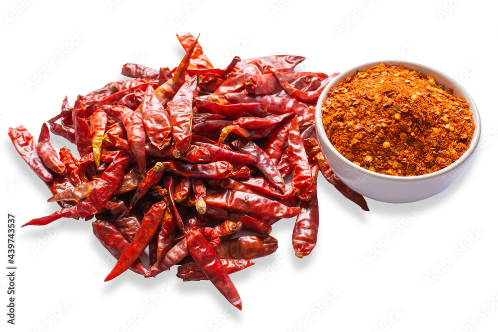 Fototapeta premium Cayenne pepper in white ceramic bowl , Dry red chili isolated on white background.