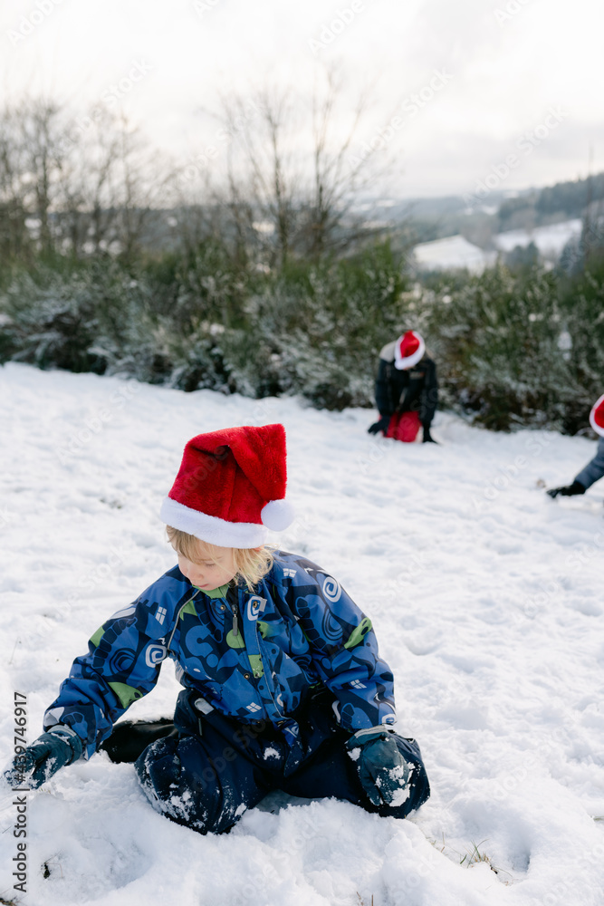 little girl making a snowman 