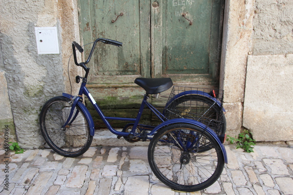 Tricycle in the Croatian fishing port of Rovinj. Tricycle in the Croatian fishing port of Rovinj.