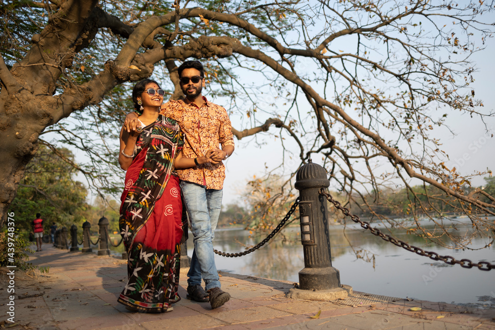 Indian couple making interaction at outdoors Indian couple making interaction at outdoors