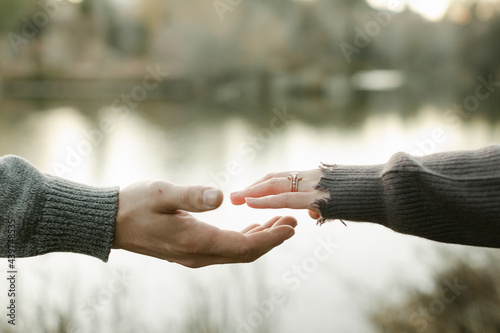 A Couple's Hands Reach Out to Each Other