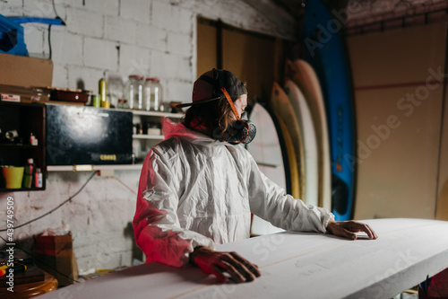 Young man working at his workshop