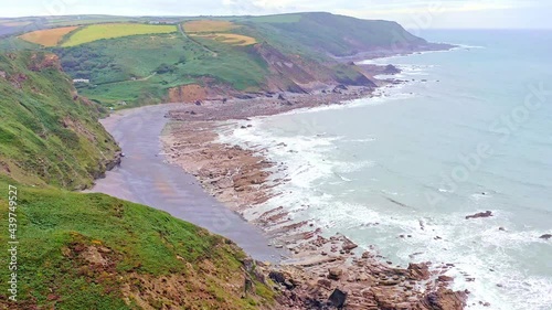 Smooth Aerial Drone Pull Out - Cornish Coast Line, Millook Haven and the Atlantic Cliffs Near Widemouth Bay Cornwall photo