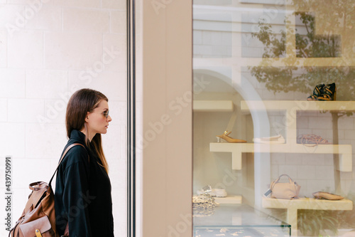 Woman in front of the shop window photo