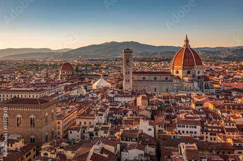 Florence, Italy - 20 June, 2019 :  view of Cathedral of Santa Maria del Fiore, known for its red-tiled dome, overview from Arnolfo Tower (Torre di Arnolfo) - 95m-tall medieval tower. photo