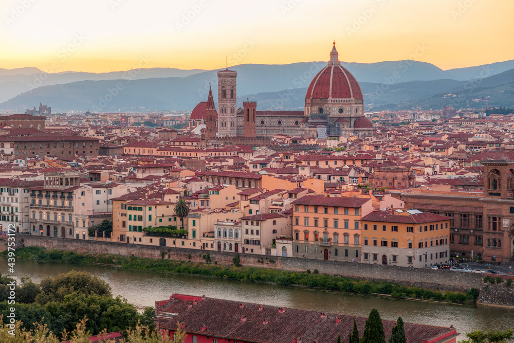 Florence, Italy -20 June, 2019 : panoramic sunset view of Cathedral of Santa Maria del Fiore, known for its red-tiled dome, picture was taken  from Piazzale Michelangelo.