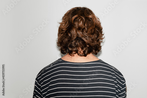 Back view of a curly man photo