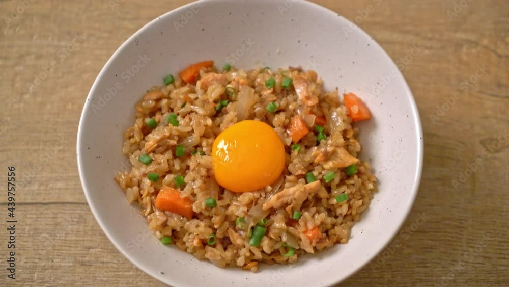 salmon fried rice with pickled egg on top - Asian food style salmon fried rice with pickled egg on top - Asian food style