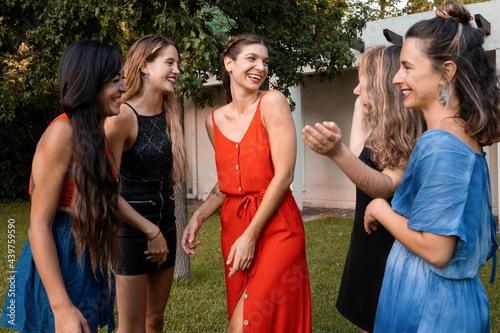 Group of young and adult women all together laughing  photo