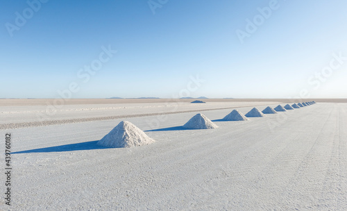 Salt mining in Colchani with salt pyramids ready for harvest, Uyuni salt flat (Salar de Uyuni), Bolivia, South America.