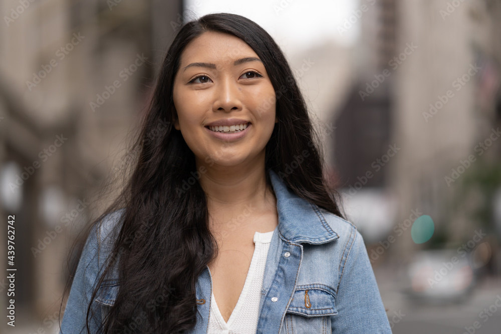 Young Asian woman in city walking street smile happy face Young Asian woman in city walking street smile happy face