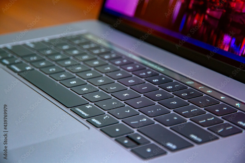 Backlit laptop keyboard glowing