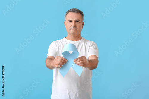Mature man with blue ribbon...