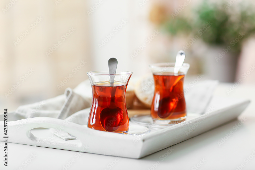 Tray with hot Turkish tea on table in kitchen Tray with hot Turkish tea on table in kitchen