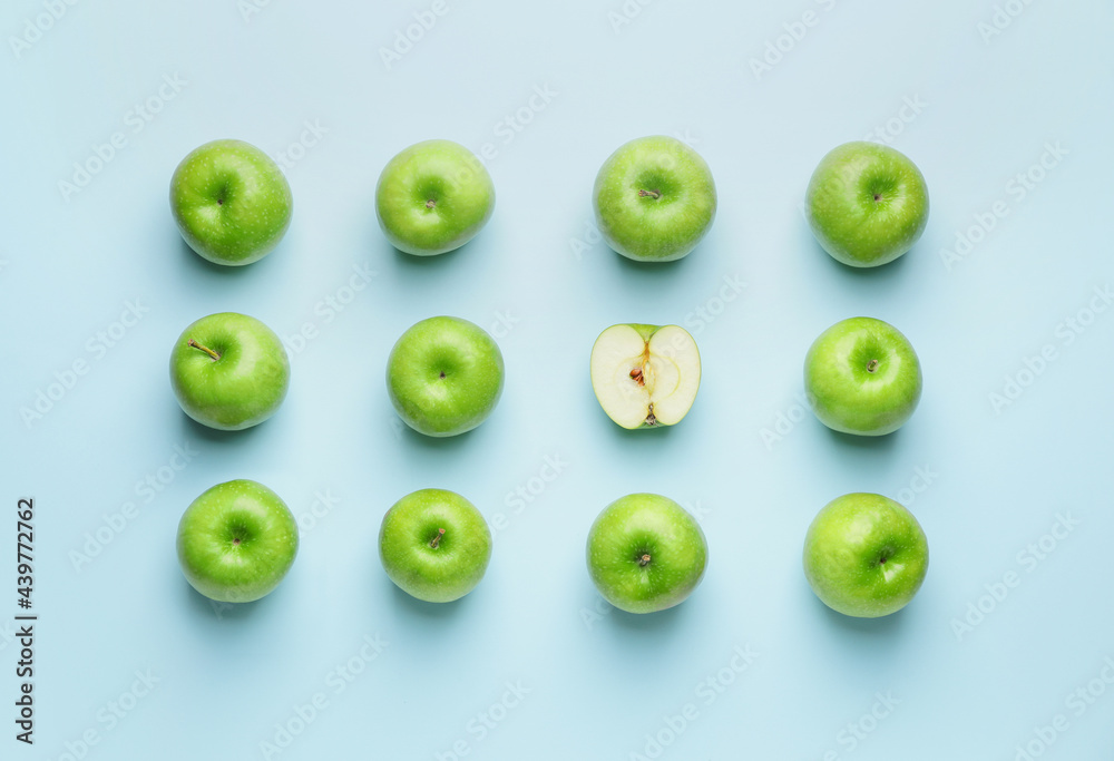Fresh green apples with piece on color background Fresh green apples with piece on color background