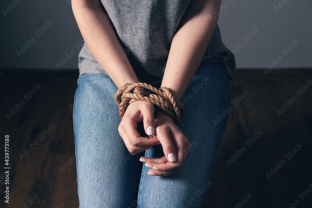 young woman's hands are tied