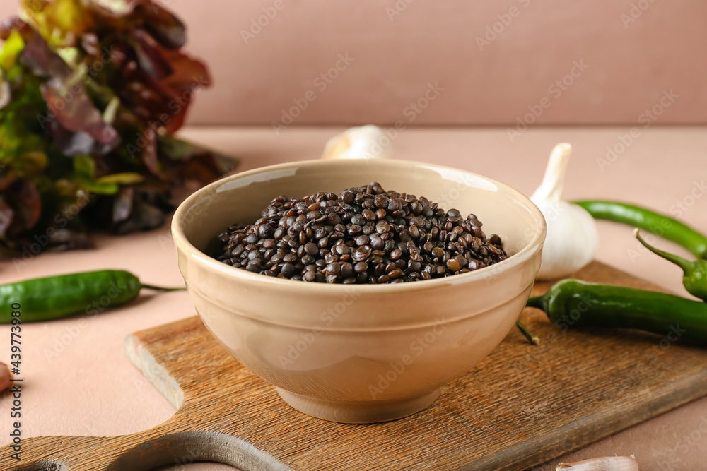 Bowl with tasty cooked lentils on table Bowl with tasty cooked lentils on table