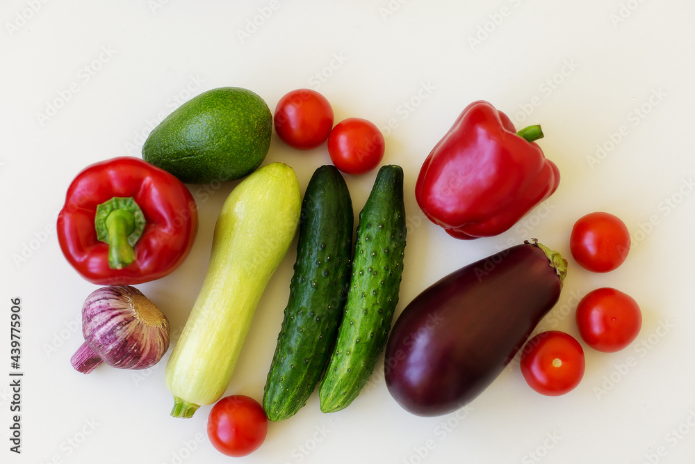 vegetables on a white background: cucumber, zucchini, garlic, eggplant, pepper, onion, avocado, tomatoes vegetables on a white background: cucumber, zucchini, garlic, eggplant, pepper, onion, avocado, tomatoes