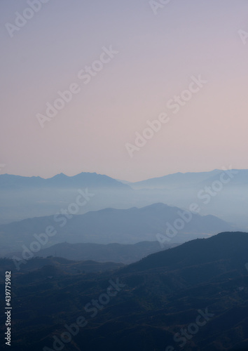 Blue ridge mountains with orange sky. Vertical picture