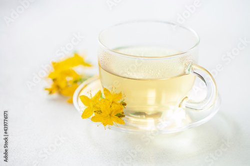 Herbal tea  st. john s wort in glass cup. Alternative Medicine and Relax Drink