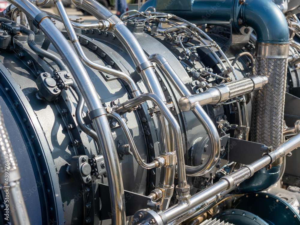 Close-up of the new engine for the ship. Mechanism with a bunch of pipes and parts Close-up of the new engine for the ship. Mechanism with a bunch of pipes and parts