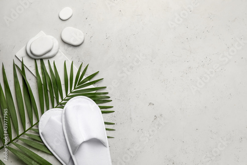 Photography Spa stones with slippers on grey background