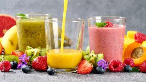 fruit juice or smoothie pouring into a glass