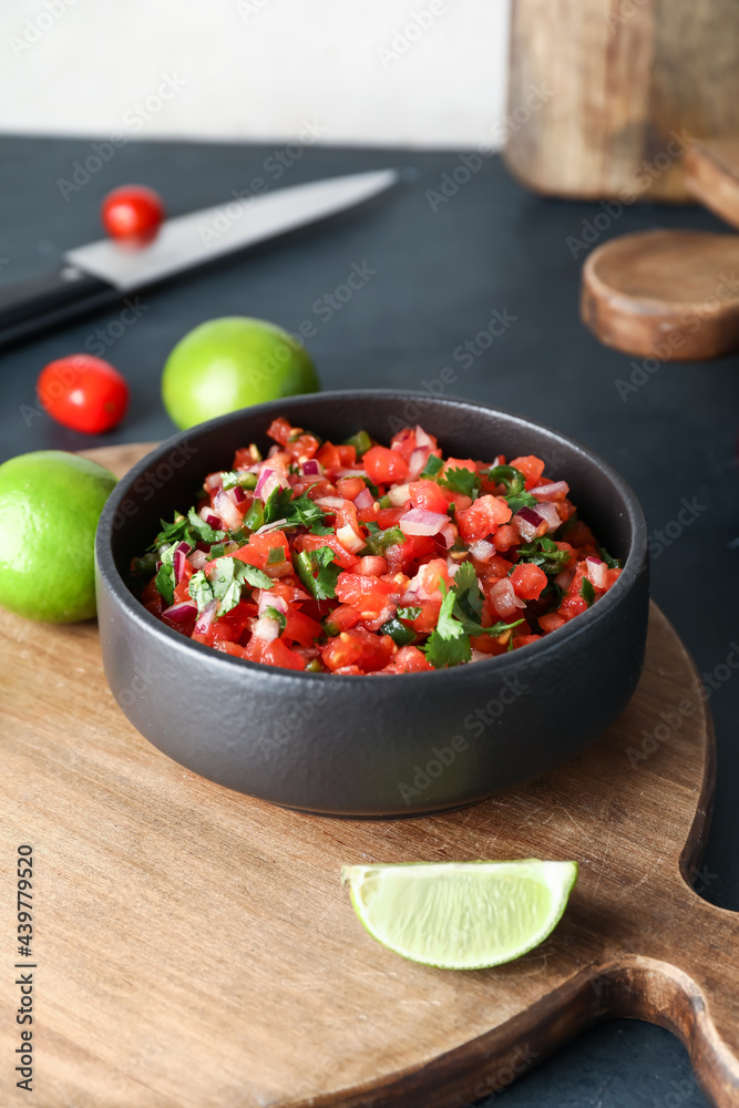 Bowl of tasty Pico de Gallo salsa on table Bowl of tasty Pico de Gallo salsa on table