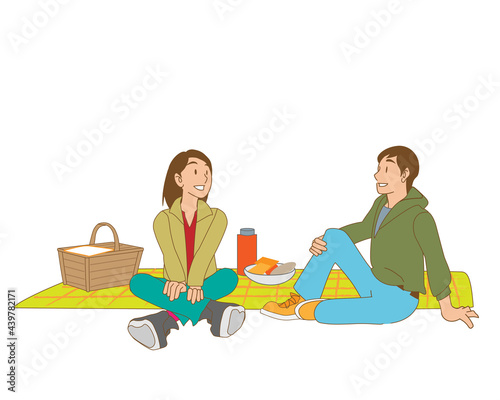 ピクニックで会話がはずむ日本人カップル