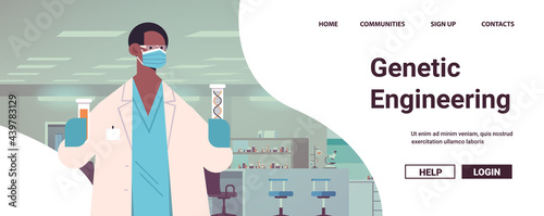 scientist in mask working with DNA in test tubes researcher making experiment in lab DNA testing genetic engineering